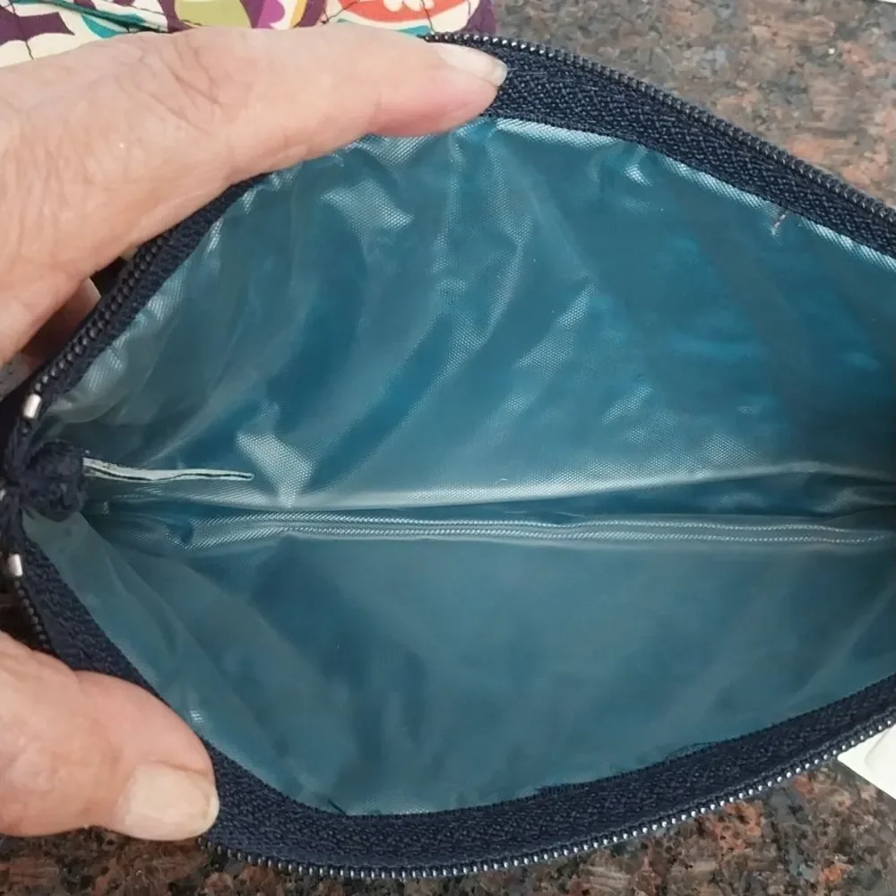 Vera Bradley  Cosmetic Case  and Wristlet.  They are both excellent condition.